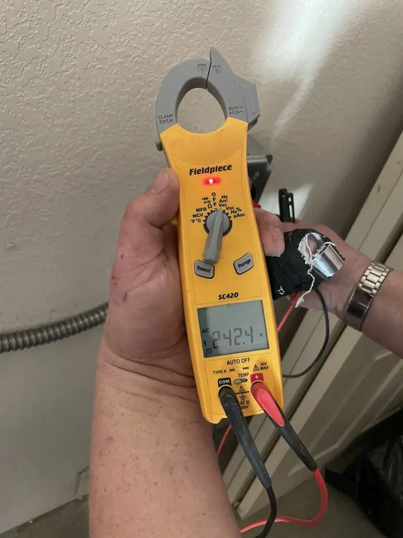 Voltage testing with clamp meter during Recessed Lighting Installation in Tellico Village